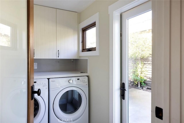 laundry room featuring a wealth of natural light, cabinet space, and independent washer and dryer