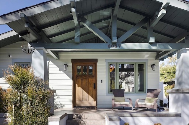 doorway to property featuring covered porch