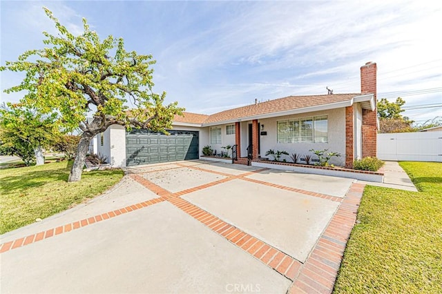 ranch-style home featuring stucco siding, concrete driveway, an attached garage, a front yard, and fence