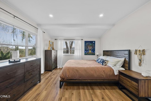 bedroom with recessed lighting, vaulted ceiling with beams, and light wood-style flooring