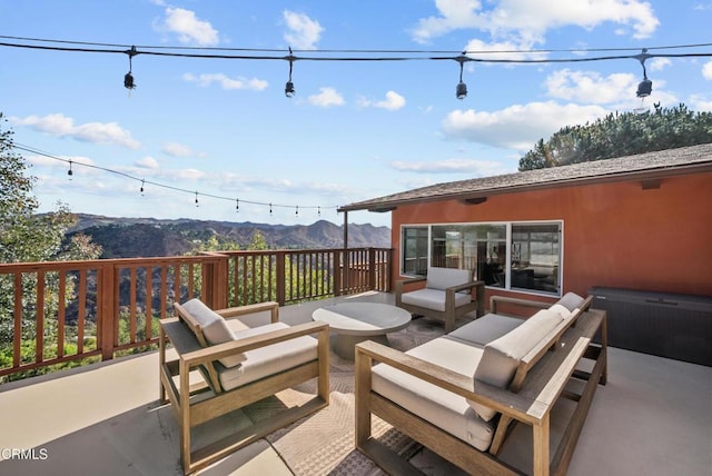 view of patio with a mountain view and an outdoor hangout area