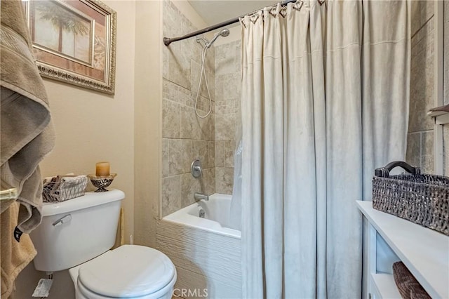 bathroom with shower / bath combo and toilet