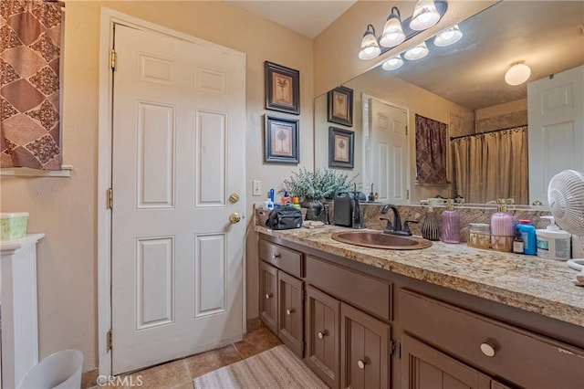 full bathroom featuring vanity and tile patterned floors