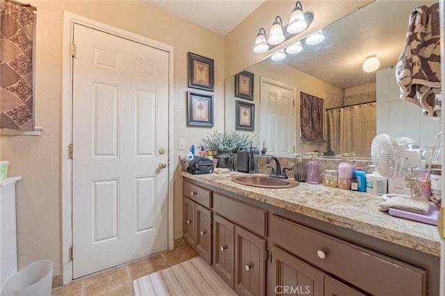 full bathroom featuring vanity and tile patterned floors