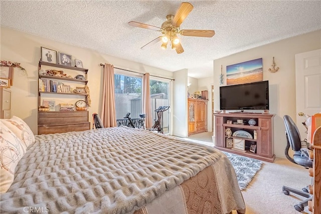 carpeted bedroom with access to exterior, a ceiling fan, and a textured ceiling