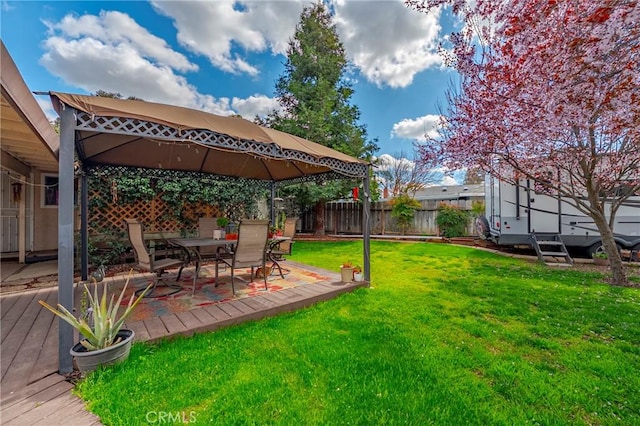 view of yard with a fenced backyard and a gazebo