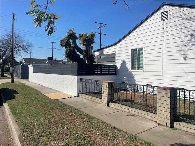 view of side of property with a fenced front yard