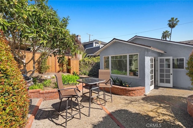 view of patio / terrace featuring outdoor dining area and fence