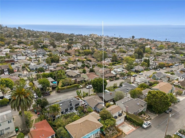 birds eye view of property featuring a water view and a residential view