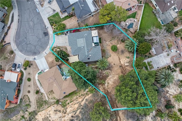 birds eye view of property with a residential view