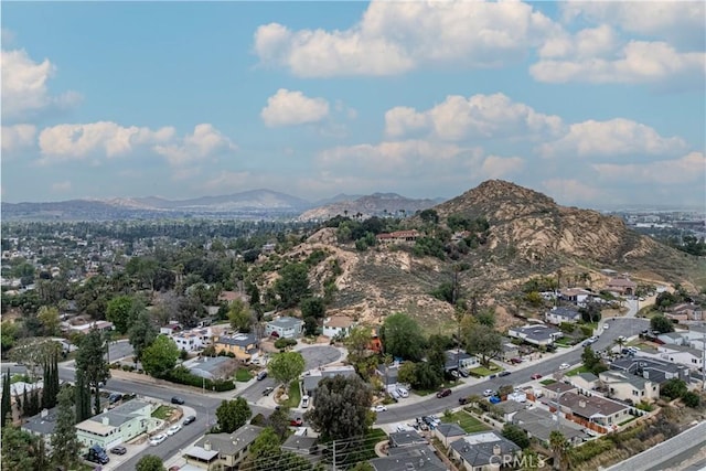 drone / aerial view featuring a residential view and a mountain view