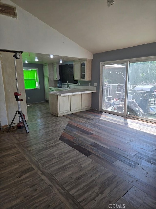 3269 Highcliff Rd, Riverside, CA 92506 - kitchen with vaulted ceiling, a peninsula, light countertops, dark wood-type flooring, and a sink