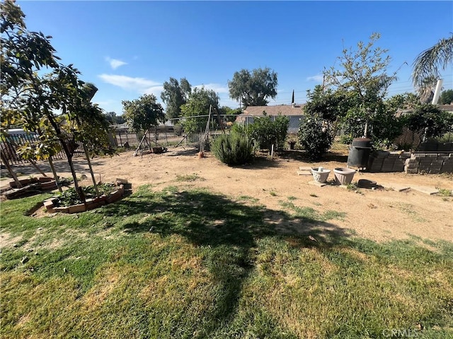 view of yard featuring a garden and fence