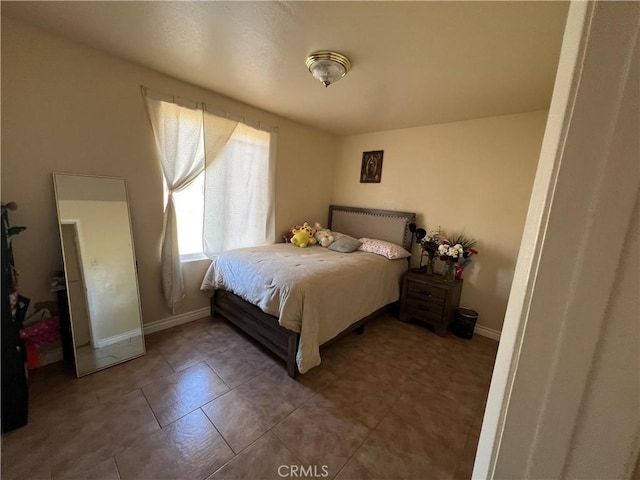 tiled bedroom with baseboards