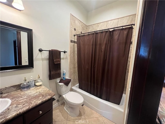 bathroom featuring toilet, tile patterned floors, shower / bath combo, and vanity