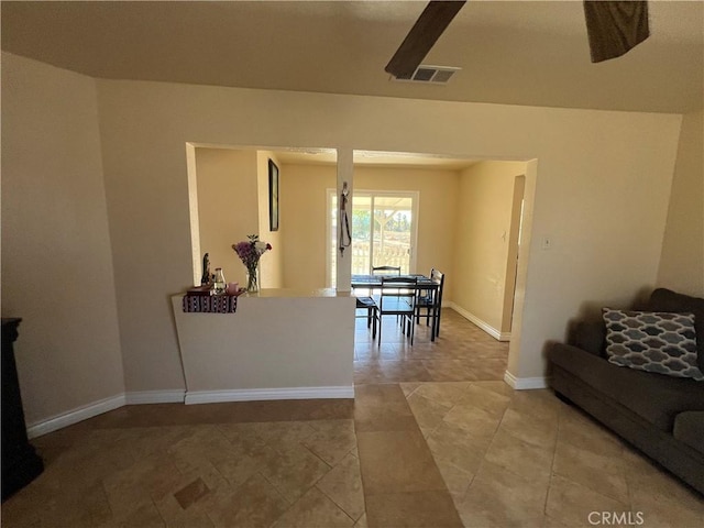 living room featuring visible vents and baseboards