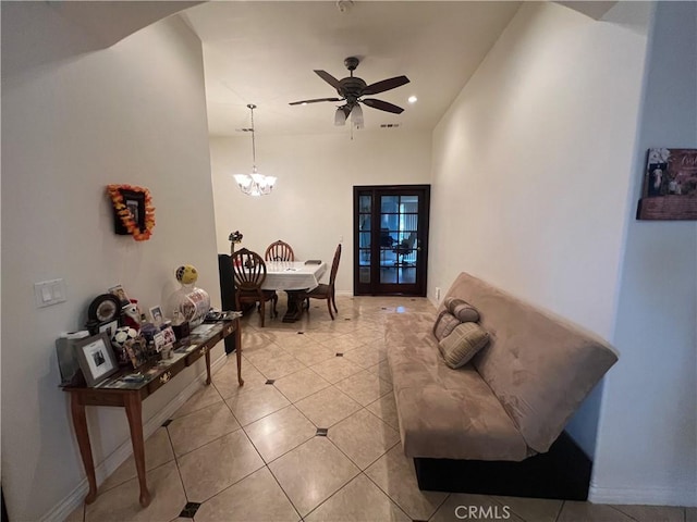 dining room with light tile patterned floors, recessed lighting, ceiling fan with notable chandelier, and baseboards