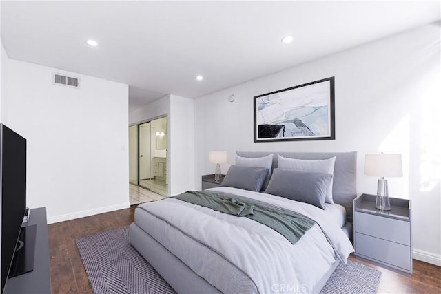 bedroom with baseboards, visible vents, wood finished floors, and recessed lighting