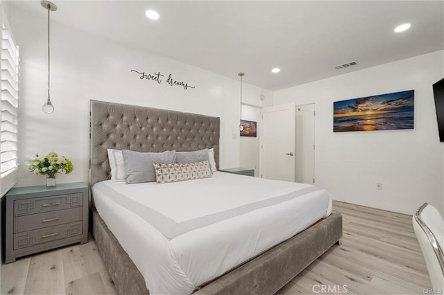 bedroom with light wood-type flooring, visible vents, and recessed lighting