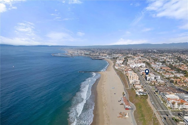 drone / aerial view with a view of the beach and a water view