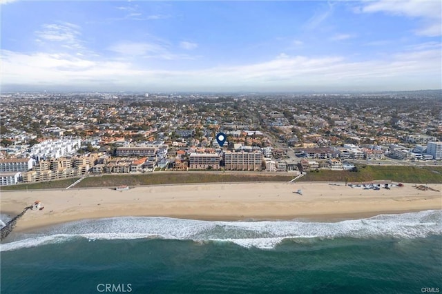 bird's eye view with a water view, a beach view, and a city view