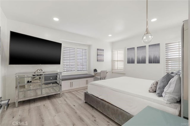 bedroom with recessed lighting and light wood-style flooring