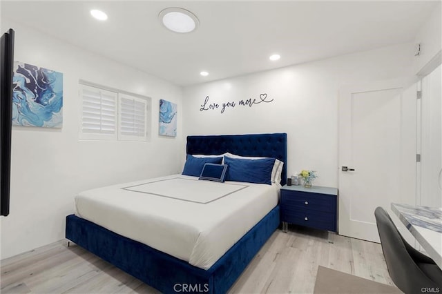 bedroom with light wood-style flooring and recessed lighting