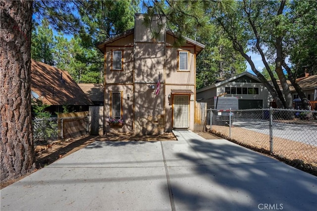 chalet / cabin with a gate and fence