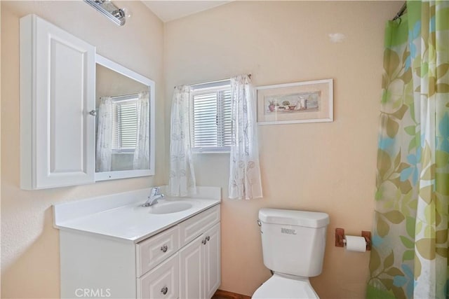 full bath with toilet and vanity