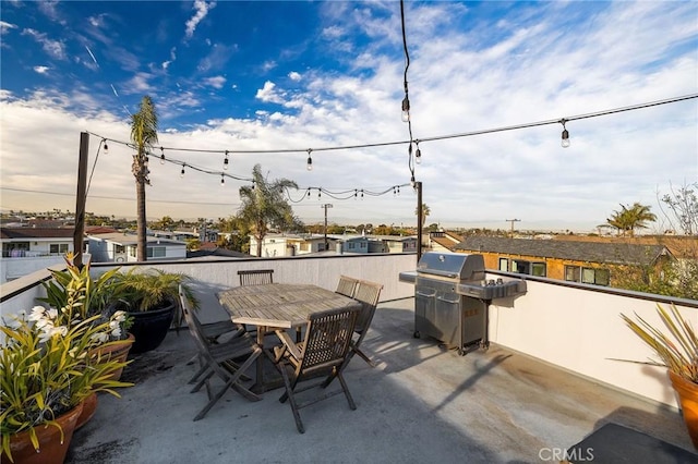 view of patio / terrace with outdoor dining area and a grill