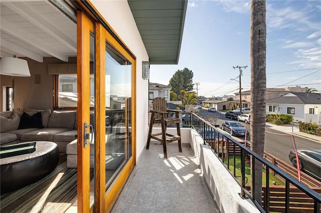 balcony with a residential view and an outdoor living space