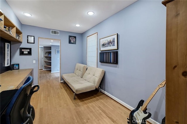 office with light wood-type flooring, visible vents, baseboards, and recessed lighting