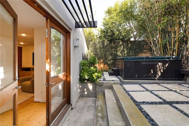 view of patio with a hot tub