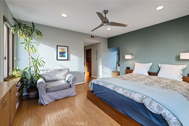 bedroom featuring light wood-type flooring, visible vents, and recessed lighting