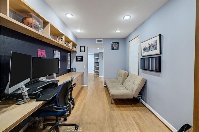 office with light wood-type flooring, visible vents, baseboards, and recessed lighting