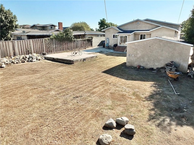 view of yard featuring a patio and fence