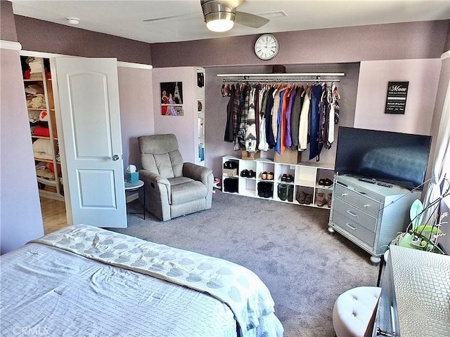 bedroom with ceiling fan, a closet, carpet, and visible vents