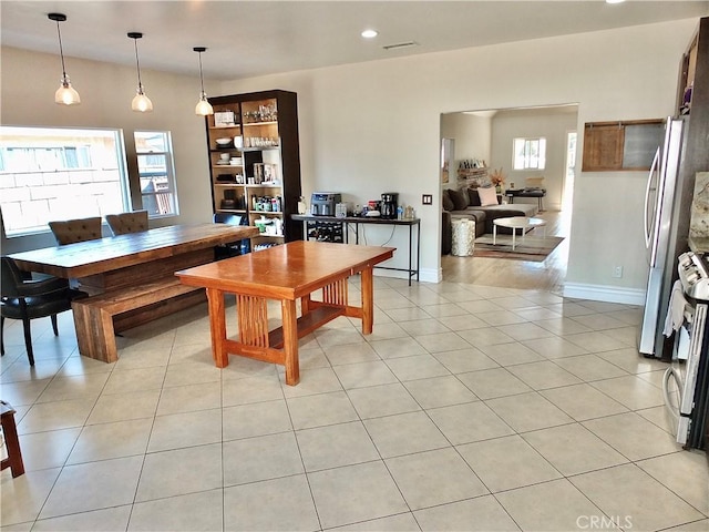 dining room with visible vents, baseboards, and light tile patterned flooring