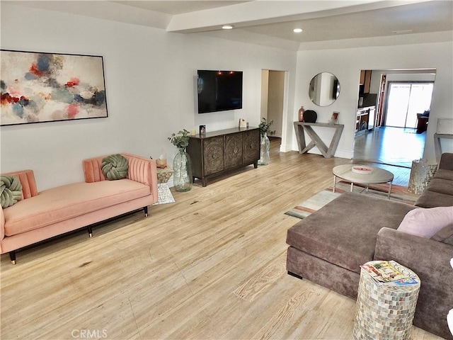 living room featuring beam ceiling, wood finished floors, and recessed lighting