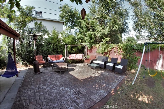 view of patio with fence and an outdoor living space