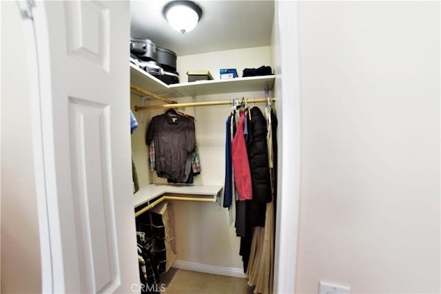 walk in closet featuring light tile patterned floors