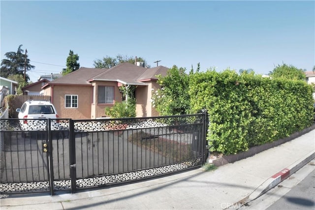 view of gate featuring a fenced front yard