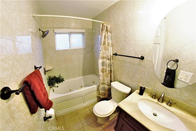 bathroom featuring tile walls, a combined bath / shower with jetted tub, toilet, vanity, and tile patterned flooring