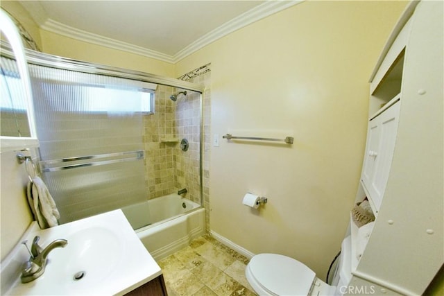 bathroom with toilet, bath / shower combo with glass door, vanity, baseboards, and ornamental molding