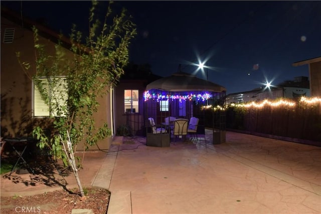 view of patio at night