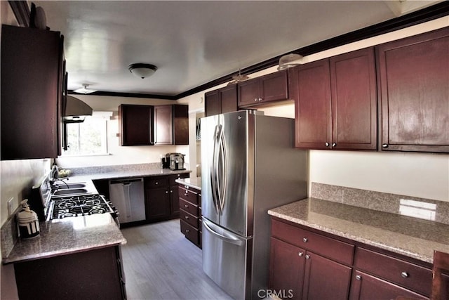 kitchen featuring stainless steel appliances, wood finished floors, and range hood