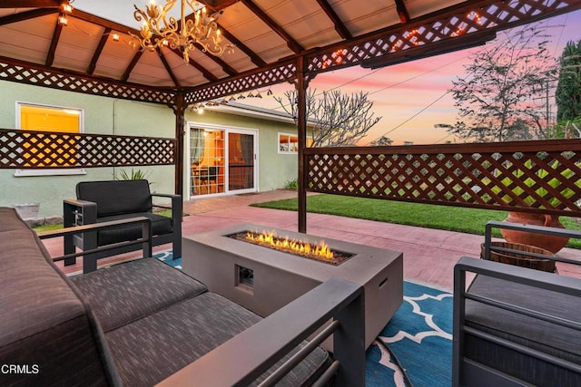 view of patio featuring a gazebo and an outdoor living space with a fire pit