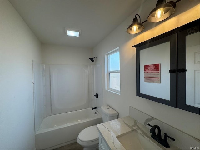 bathroom featuring bathtub / shower combination, vanity, and toilet