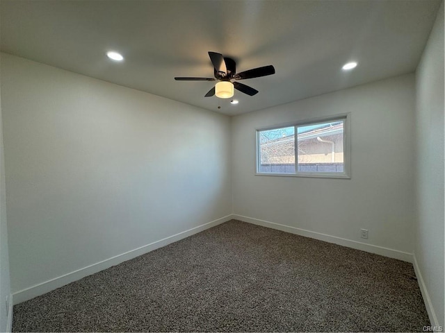 empty room featuring recessed lighting, dark carpet, baseboards, and ceiling fan