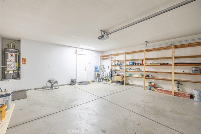 garage with water heater and a garage door opener